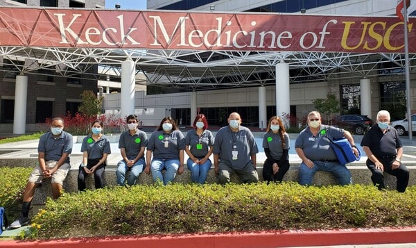 Universal Courier drivers sitting in front of Keck Medical Center of USC.